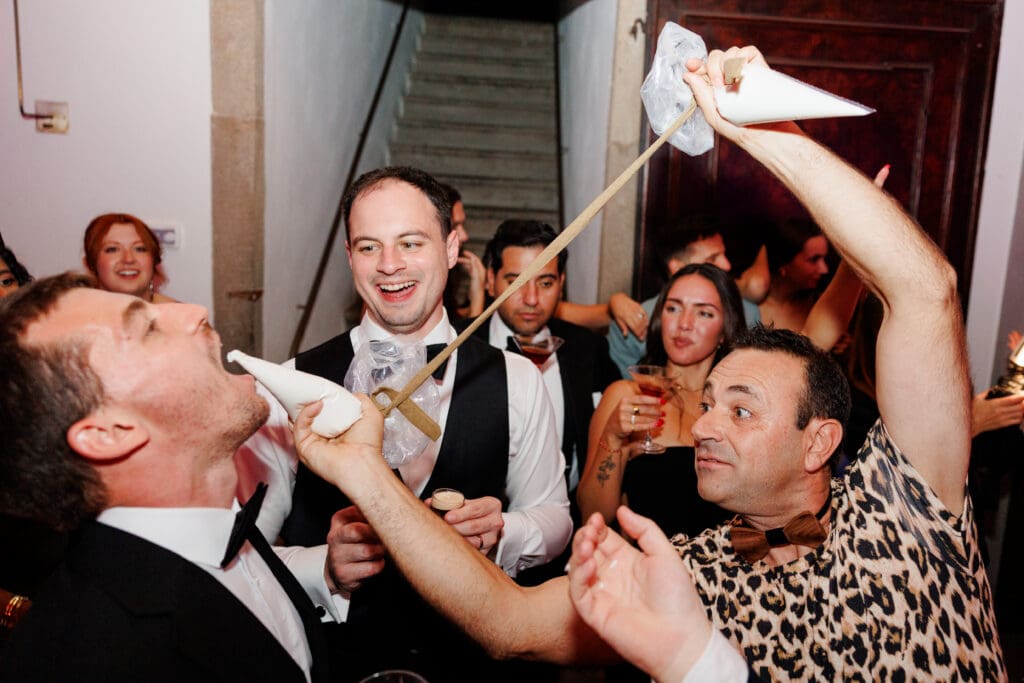 Guests waving napkins at the reception, black and white